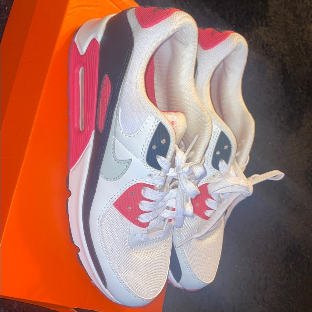 Pink, white, and black NIKE AIR MAX.